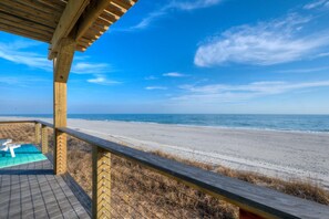 On the beach - Experience coastal bliss at Just Beachy, a 4-bedroom oceanfront retreat in Oak Island. (Oak Island)