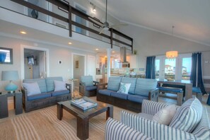 Smart TV, DVD player, books, video library - Experience coastal bliss at Just Beachy, a 4-bedroom oceanfront retreat in Oak Island. (Oak Island)