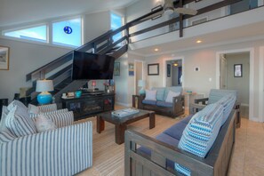 Smart TV, DVD player, books, video library - Experience coastal bliss at Just Beachy, a 4-bedroom oceanfront retreat in Oak Island. (Oak Island)