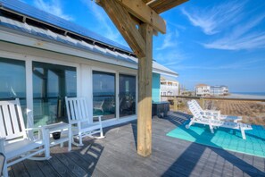 Terrace/patio - Experience coastal bliss at Just Beachy, a 4-bedroom oceanfront retreat in Oak Island. (Oak Island)