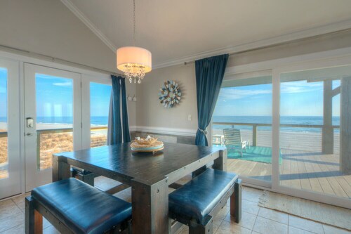 Experience coastal bliss at Just Beachy, a 4-bedroom oceanfront retreat in Oak Island.