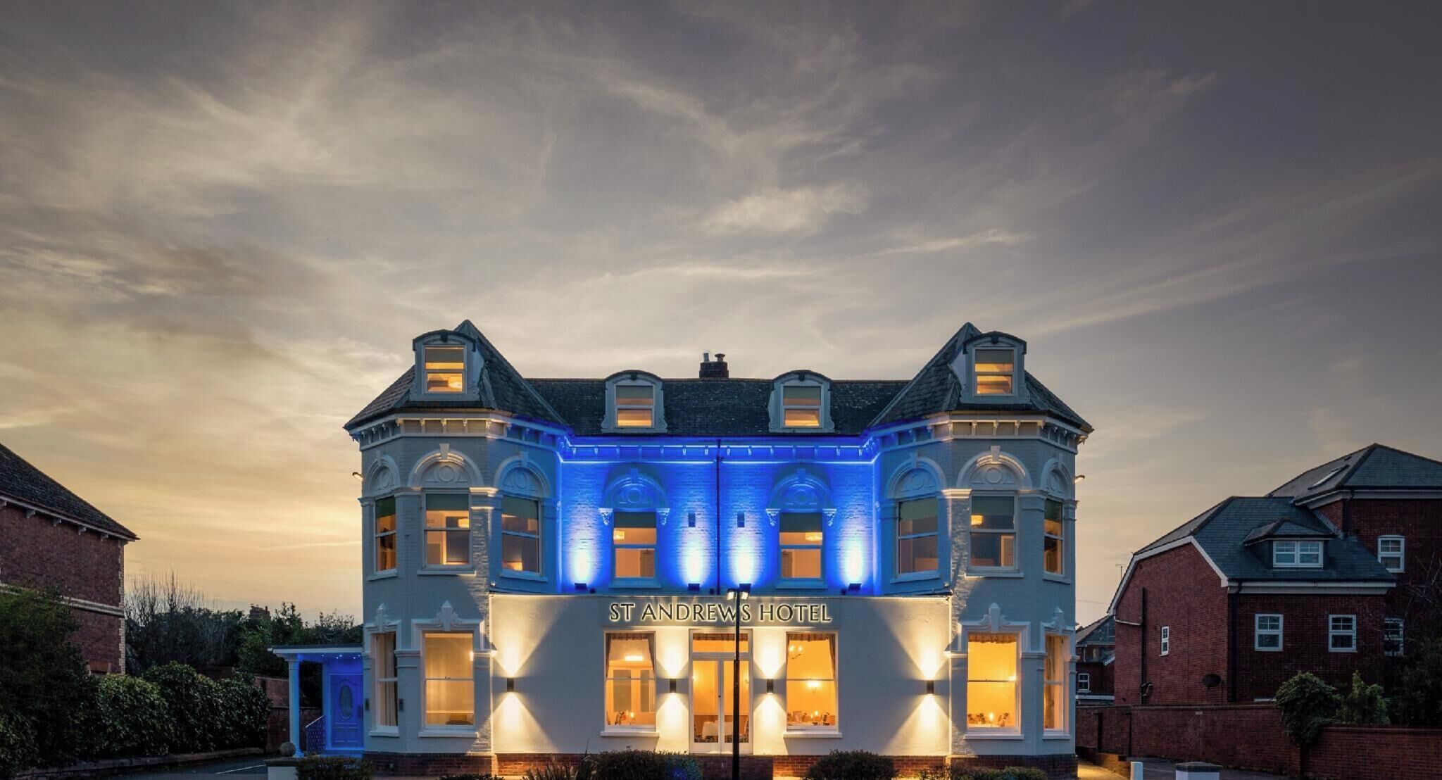 A large, historic building with a prominent entrance labeled 'ST ANDREWS HOTEL.'