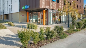 A modern building with signage for 'ibis Styles' and 'ibis Budget'.