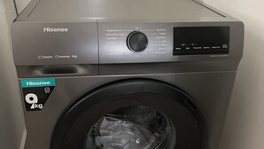 A Hisense 9kg front-loading washing machine with a control panel, a digital display, and a transparent door. - 2bedroom beachfront Apartmnt Mombasa,Seaview,Ac,pool,gym,restaurant,beach access (Mombasa)