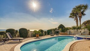 A swimming pool with lounge chairs, a small hot tub, and a view of the ocean. - 'like No Other' in the Panhandle of Florida (Panama City Beach)