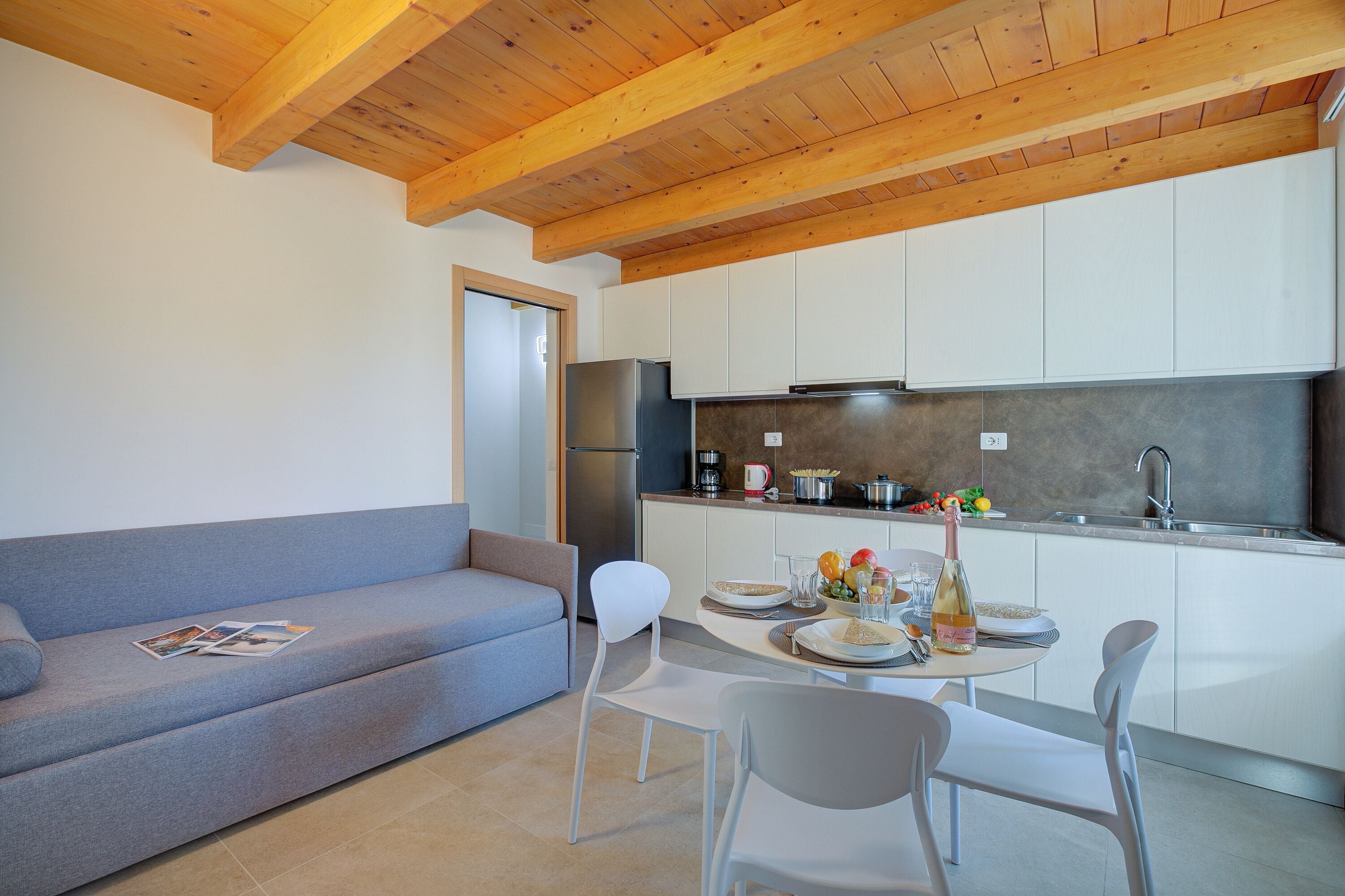 Family Apartment, Multiple Bedrooms (Residenza Lugana - Apt 4) | Private kitchenette | Fridge, microwave, stovetop, coffee/tea maker