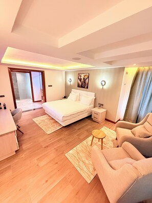 Deluxe Single Room, Courtyard View | In-room safe, desk, laptop workspace, iron/ironing board - Boynuz Hotel (Nyahururu)
