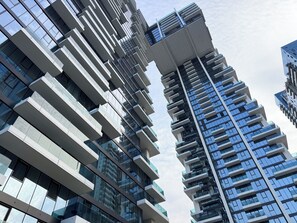 A high-rise building with multiple floors, large windows, and a modern architectural design.