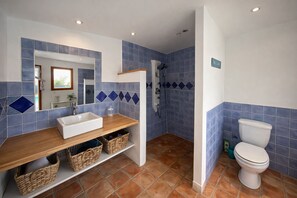 Shower, hair dryer, towels, toilet paper