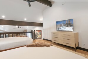 A bedroom with two beds, a wooden ceiling, a dresser, and a painting of a snowy landscape. - Ski Retreat Hot Tub 2br + Loft 2 Bedroom Condo (Park City)
