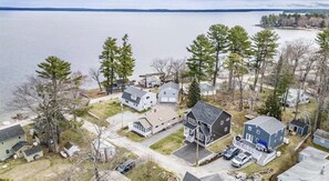 A residential area with houses and a lake. - Cove Overlook Limit 6 3 Bedroom Home (Standish)