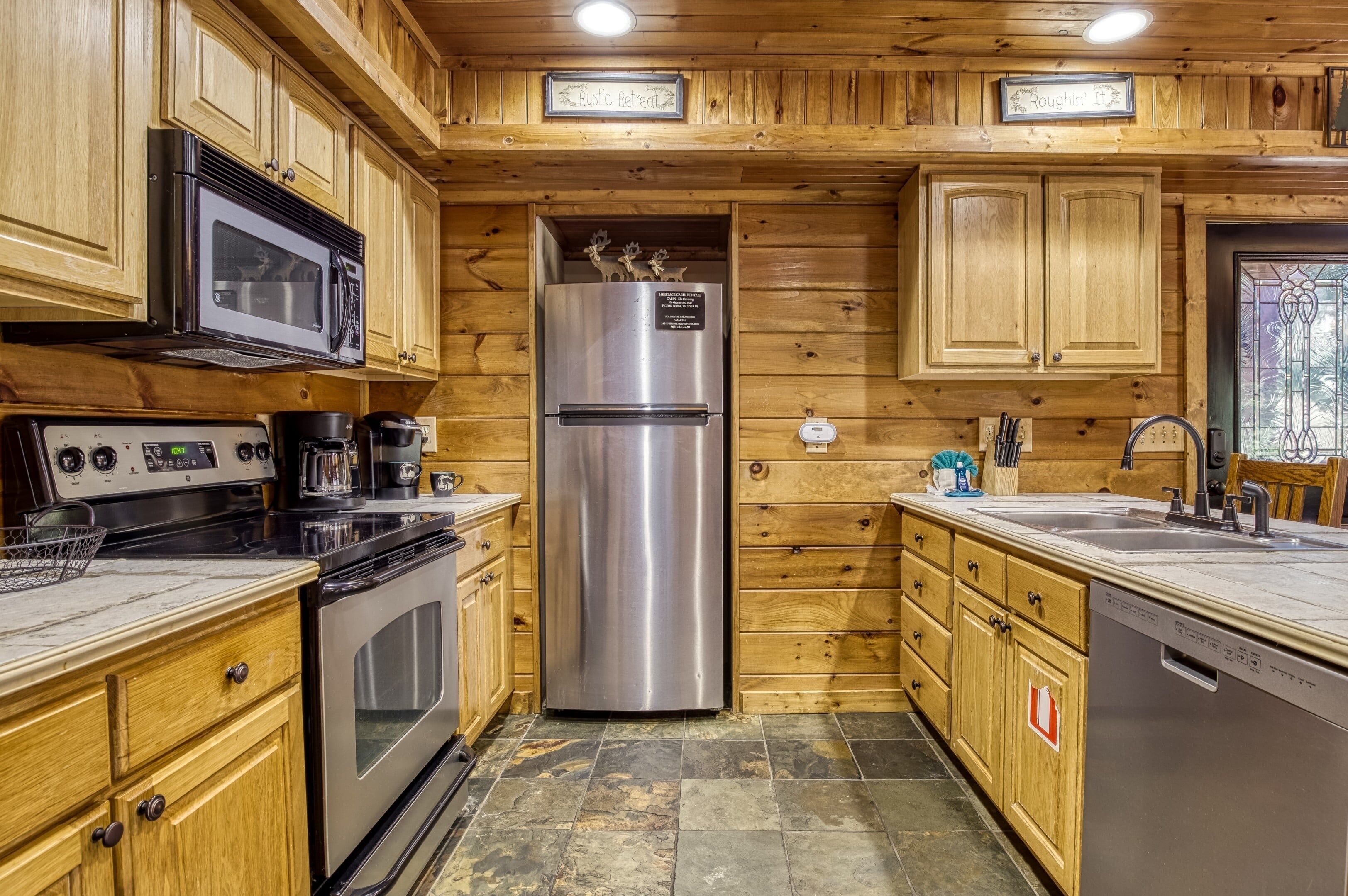 A kitchen with wooden cabinets, stainless steel appliances, and a built-in dishwasher.