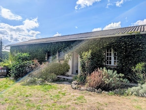 A building with a tiled roof, ivy-covered walls, and a front door with a 'Private' sign. - La Grande Rossignol: Pool, spacious rooms, and private bathrooms in Occitanie. (Belvèze)