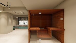 Un intérieur moderne avec un banc en bois, un éclairage encastré et un panneau de commande fixé au mur.