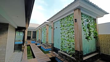A spa area with individual treatment rooms, a central pathway, and a small water feature.