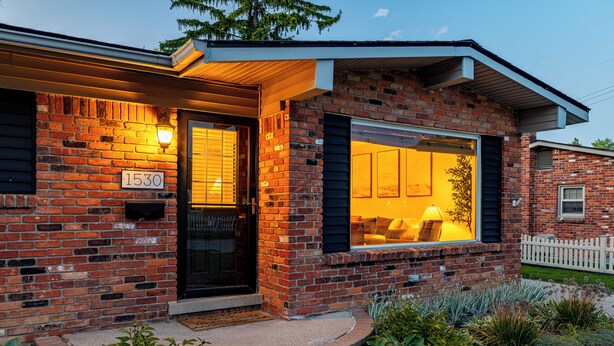 A brick house with a number '1530' sign, a front door, and a window with a view of the interior. - Luxury Look in Plymouth I Walk to Downtown l Sleeps 8 I Hot Tub (Plymouth)