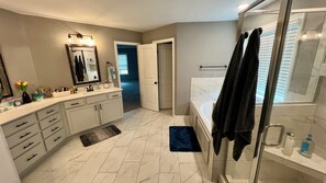 Jetted tub, hair dryer, towels, soap