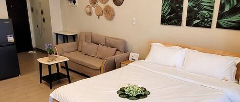 Comfort Studio, 1 Queen Bed, Balcony, City View | Living area | 32-inch Smart TV with digital channels