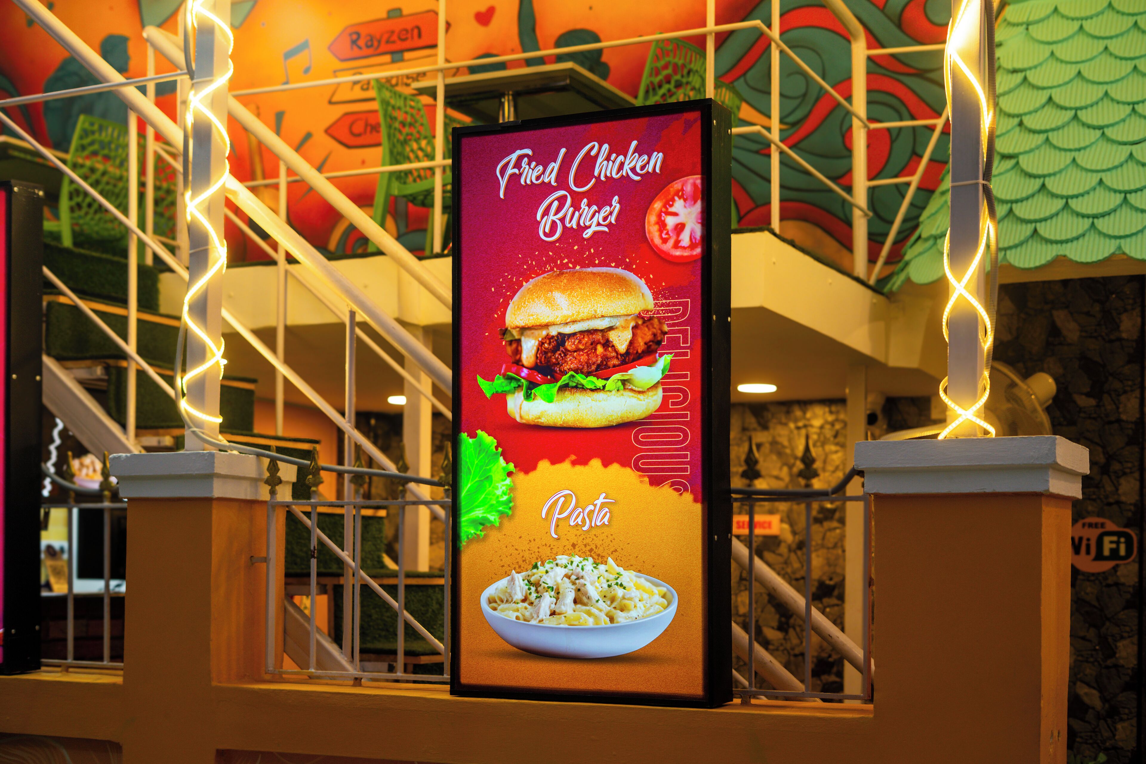 A menu board advertising fried chicken burgers and pasta.