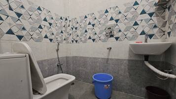 Bidet, towels, soap, toilet paper