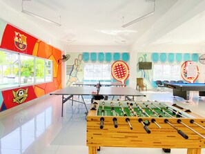 A sports hall with a foosball table, ping pong table, and a basketball court. - ®{The-Comfty-Spot} Experience @SD +WiFi (Santo Domingo)