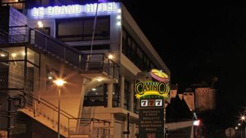 A building with a sign for 'Le Grand Hotel' and 'Grand Casino'.