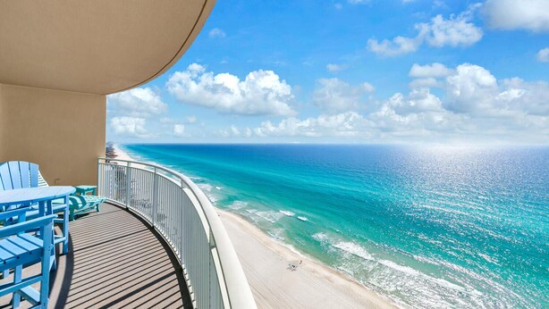 A balcony with a view of the ocean and beach. - Aqua Sunset Retreat | Beachfront Condo w/ Large Balcony | Aqua 2003 (Panama City Beach)