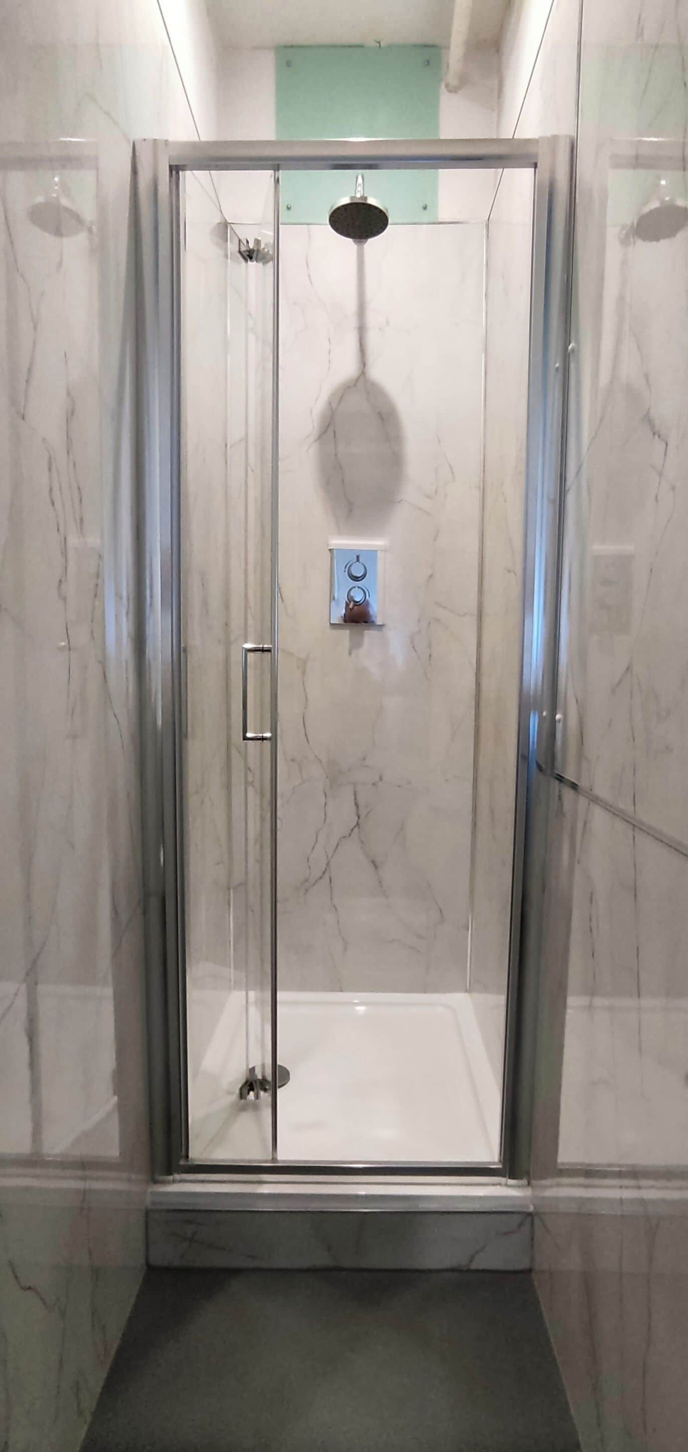 Shower, towels, soap, toilet paper