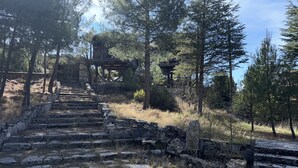 A stone staircase leading to a wooden structure surrounded by trees. - Ali Paşa Konağı (Akseki)