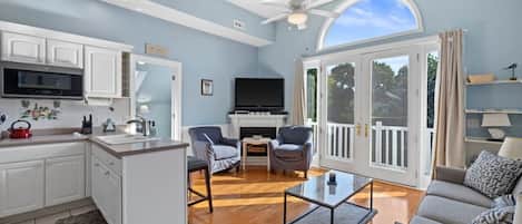 TV, fireplace, books, printers