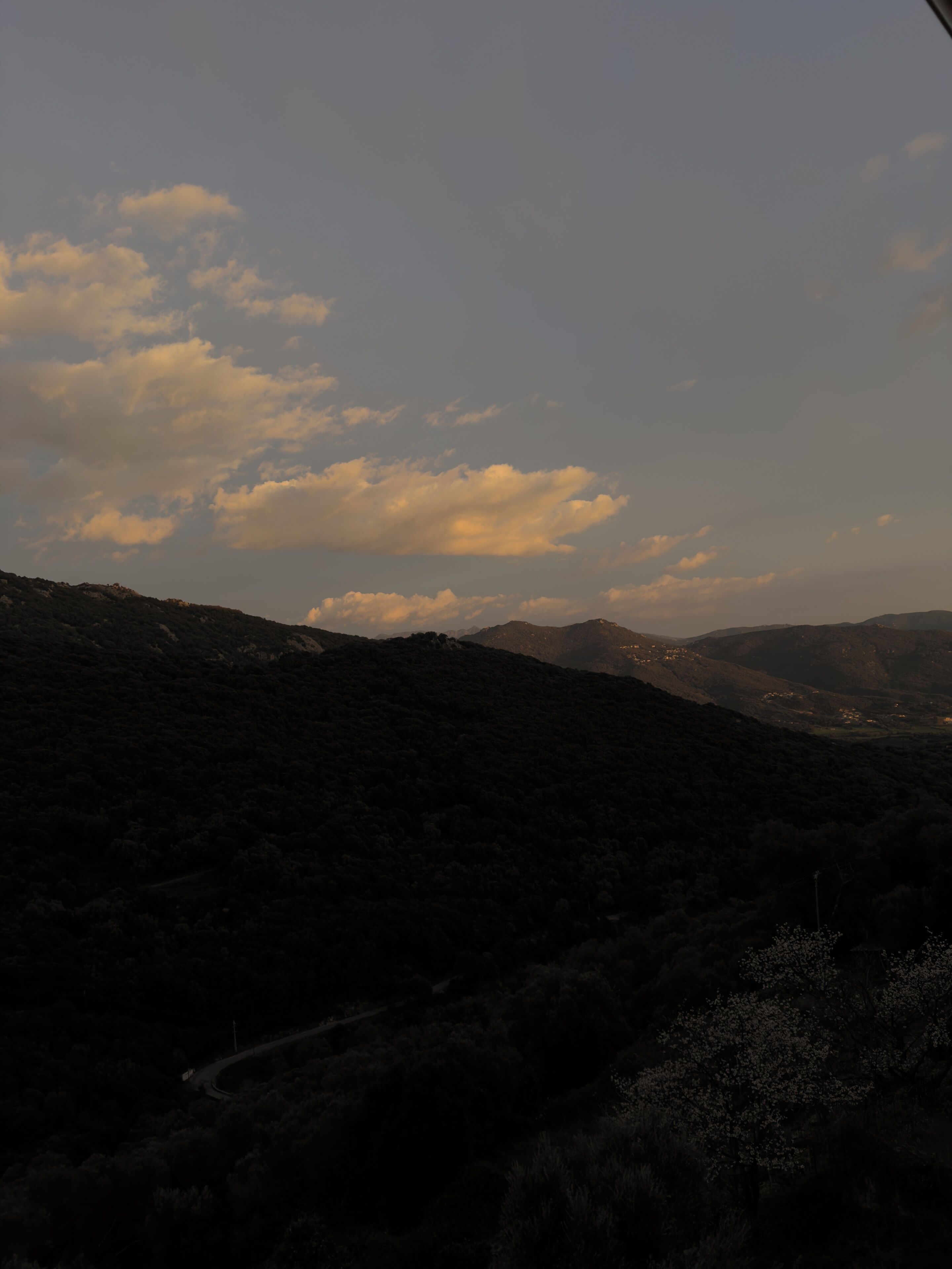 A mountainous landscape with a winding road.
