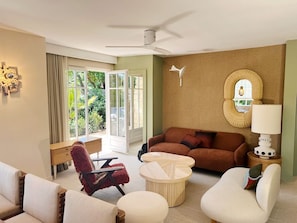 A modern living room with a sofa, armchairs, a coffee table, and a lamp. - Renovated house in top Cap Ferret location A0344 (Lège-Cap-Ferret)