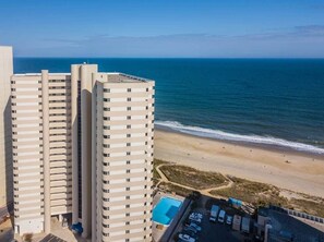 A high-rise hotel with a swimming pool and beach view. - Oceanfront 15th Floor Condo w/ Balcony & Pool (Ocean City)
