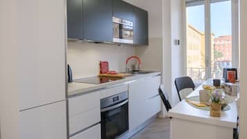 Leilighet, balkong, byutsikt | Eget kjøkken | Espressomaskin og vannkoker