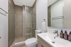 Shower, hair dryer, towels, soap - One Rosebank | Rustic Luxe 2BR Haven (Johannesburg)