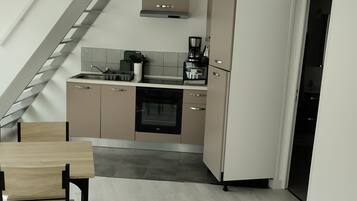 Microondas, horno y placa de cocina