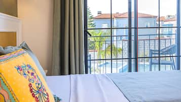 Superior Room, Pool View | In-room safe, desk, laptop workspace, blackout drapes