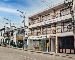A hotel with a sign reading "GRAN PLAZA HOTEL" and a visible entrance. - GRAN PLAZA SAN AGUSTIN (San Agustín)