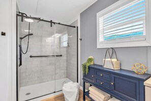 Shower, hair dryer, towels, soap