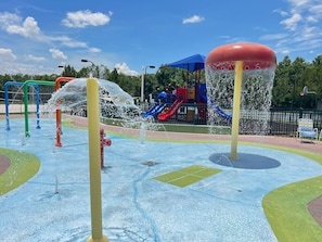 A water play area with colorful slides and a red fire hydrant. - #19-105 Seven Dwarf Villa Resort near Disney Epic (Kissimmee)