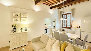 Deluxe Apartment, 2 Bedrooms, Balcony, City View | Living area | Flat-screen TV
