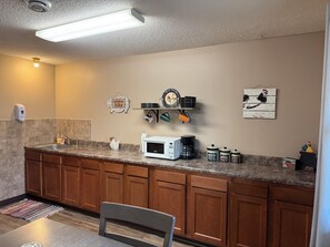 Fridge, microwave, stovetop, coffee/tea maker