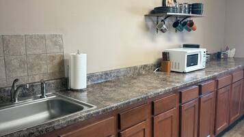 Fridge, microwave, stovetop, coffee/tea maker