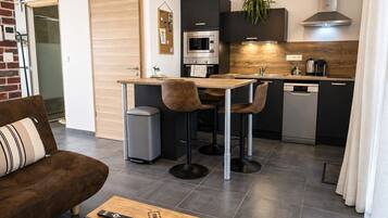 Deluxe Studio, Pool View | Living area | 32-inch flat-screen TV with digital channels