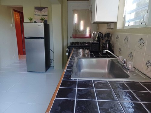 Daily Spot - Tranquil two-bedroom apartment surrounded by lush tropical views.