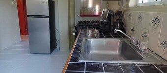 Daily Spot - Tranquil two-bedroom apartment surrounded by lush tropical views.