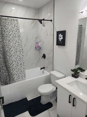 Hair dryer, towels, soap, toilet paper - Mayfair Suite (Airdrie)