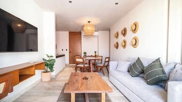 Superior Suite | Living area | 50-inch flat-screen TV with digital channels