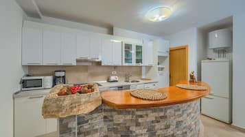 Apartment, 2 Bedrooms | Private kitchen | Full-size fridge, microwave, stovetop, dishwasher