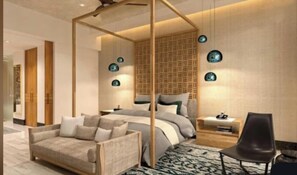 A modern bedroom with a canopy bed, a sofa, a nightstand, and a chair.